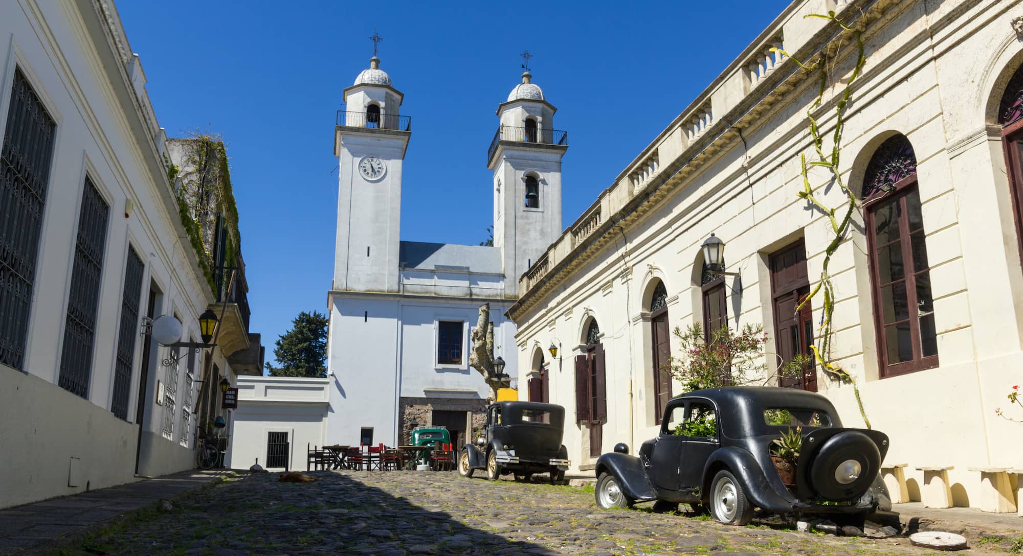 Obsolete cars, in front of the church of Colonia del Sacramento, Uruguay