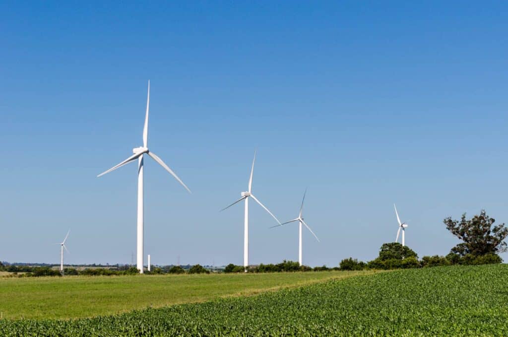 Row of three modern windmills in the countryside near tarariras colonia uruguay