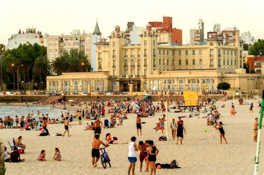 Sunset on Ramyres beach with bathers on a summer's day in Montevideo Uruguay