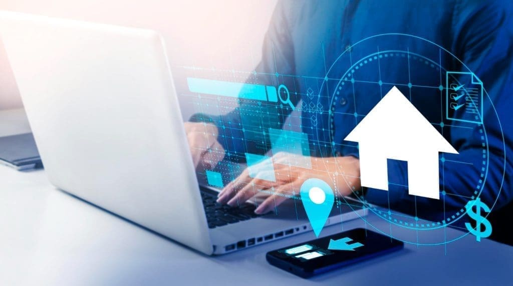 Person using a laptop overlaid with digital icons representing real estate technology, including a house and map pin.